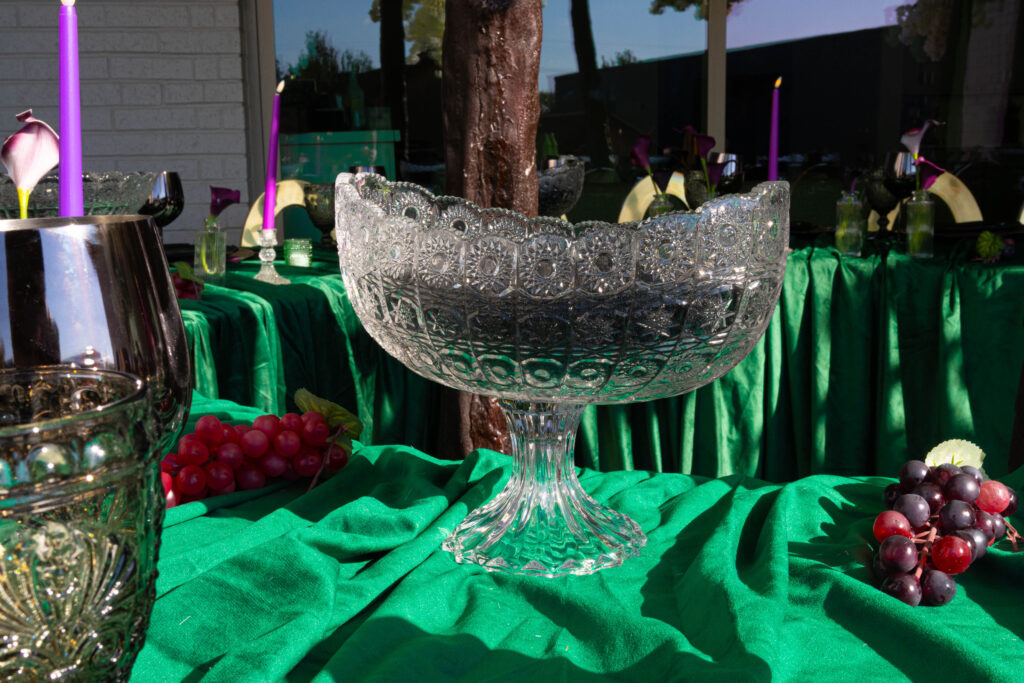 black sand candle in Cut crystal bowl on emerald velvet linen demonstrating touchable textured décor.