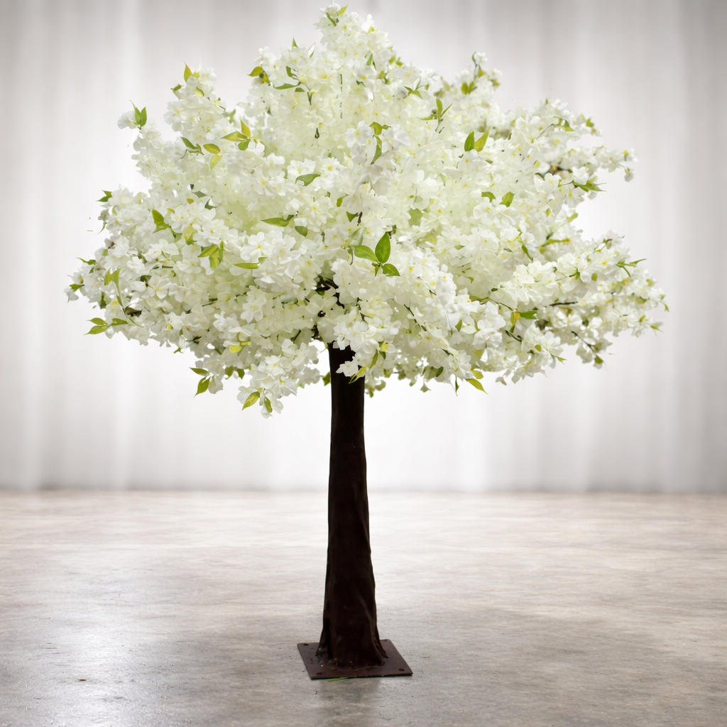 Lifelike white cherry blossom artificial tree rental used as a centerpiece or aisle liner for luxury events in Dallas